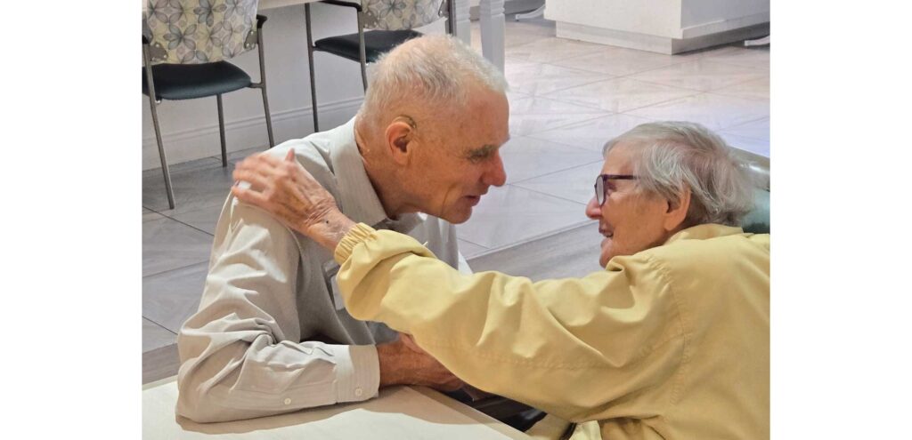 Pastor Dick interacts with a resident
