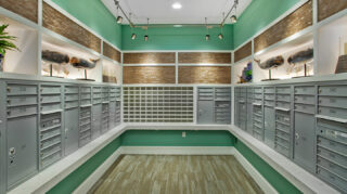 Mail room with resident mailboxes, package delivery lockers, decorative displays, and convenient access near the lobby at Trinity Springs